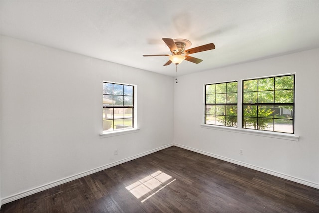 612 Elm St, Hurst, TX 76053 - empty room featuring dark wood-style flooring and a ceiling fan