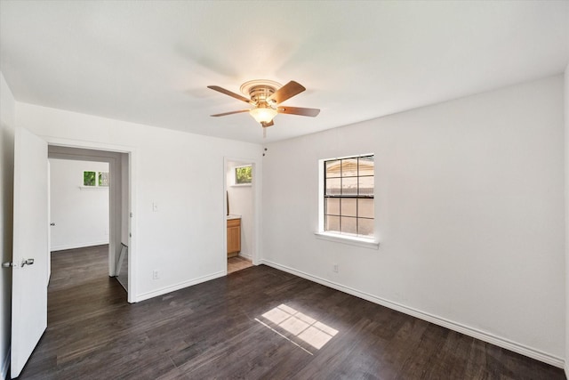 612 Elm St, Hurst, TX 76053 - unfurnished bedroom featuring dark wood-style flooring and a ceiling fan