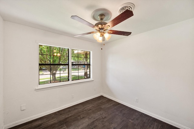 612 Elm St, Hurst, TX 76053 - spare room featuring healthy amount of natural light, dark wood-type flooring, and a ceiling fan
