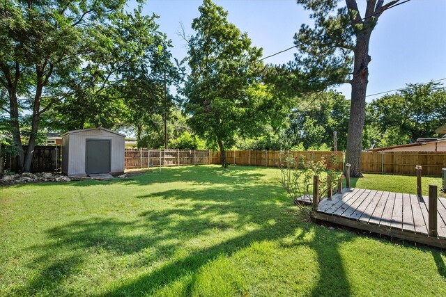 612 Elm St, Hurst, TX 76053 - fenced backyard with a wooden deck and a shed