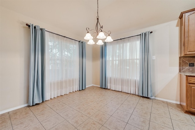 505 Glacier St, Desoto, TX 75115 - unfurnished dining area with a chandelier and light tile patterned flooring