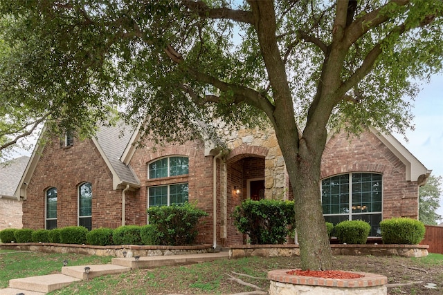 505 Glacier St, Desoto, TX 75115 - view of front of property with brick siding and roof with shingles
