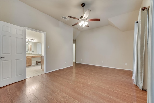 505 Glacier St, Desoto, TX 75115 - unfurnished bedroom with light wood-style flooring, vaulted ceiling, ensuite bath, and a ceiling fan
