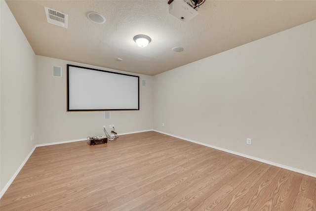 505 Glacier St, Desoto, TX 75115 - cinema room with light wood-type flooring and a textured ceiling