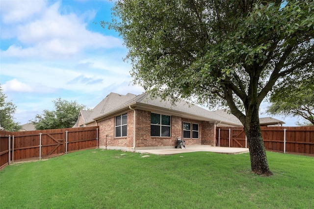 505 Glacier St, Desoto, TX 75115 - rear view of house featuring a patio area, a fenced backyard, brick siding, and a shingled roof