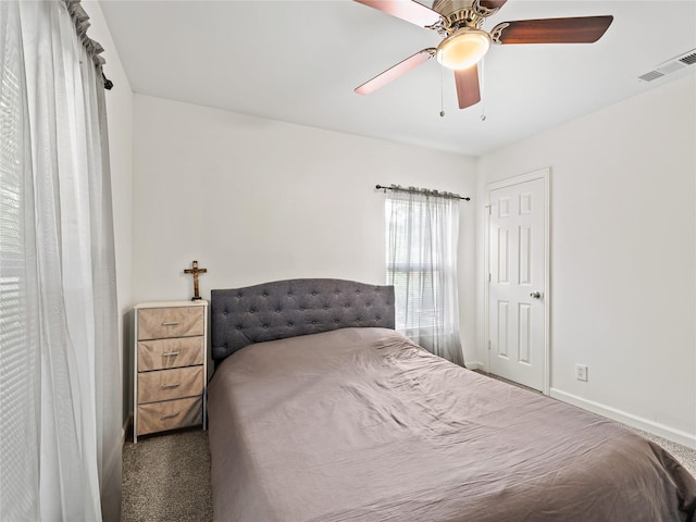 4235 Bonnie View Rd, Dallas, TX 75216 - carpeted bedroom featuring baseboards and a ceiling fan