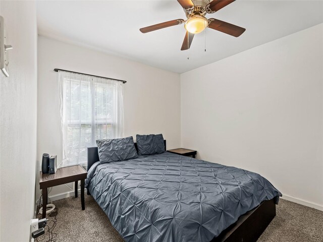 4235 Bonnie View Rd, Dallas, TX 75216 - carpeted bedroom with baseboards and a ceiling fan