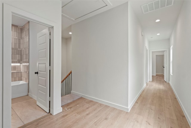 420 N Moore St, Dallas, TX 75203 - hall with light wood-style flooring, recessed lighting, and an upstairs landing