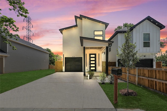 420 N Moore St, Dallas, TX 75203 - modern home featuring board and batten siding, driveway, and stucco siding