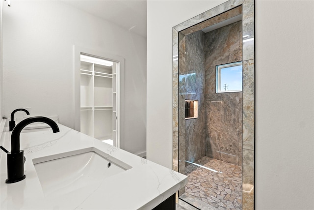 420 N Moore St, Dallas, TX 75203 - full bath featuring tiled shower, double vanity, and a walk in closet