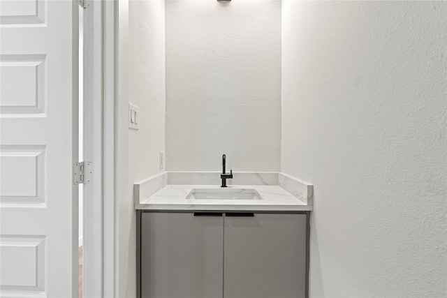 420 N Moore St, Dallas, TX 75203 - bathroom featuring a textured wall and vanity