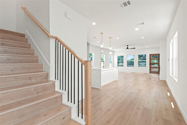 420 N Moore St, Dallas, TX 75203 - staircase with ceiling fan, recessed lighting, and wood finished floors