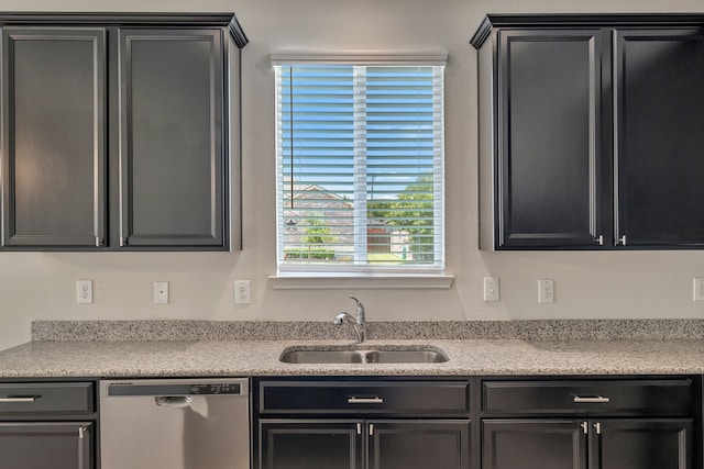 529 Mesa View Trl, Fort Worth, TX 76131 - kitchen with stainless steel dishwasher, light countertops, and dark cabinetry