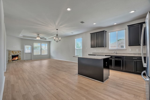 529 Mesa View Trl, Fort Worth, TX 76131 - kitchen with open floor plan, healthy amount of natural light, a kitchen island, a fireplace, and recessed lighting