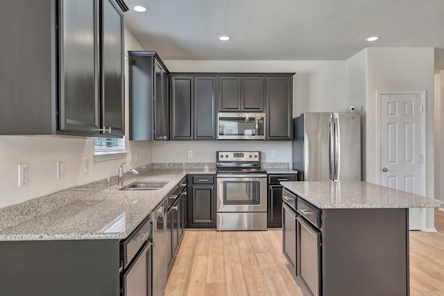 529 Mesa View Trl, Fort Worth, TX 76131 - kitchen featuring stainless steel appliances, light wood-style floors, light stone countertops, and recessed lighting