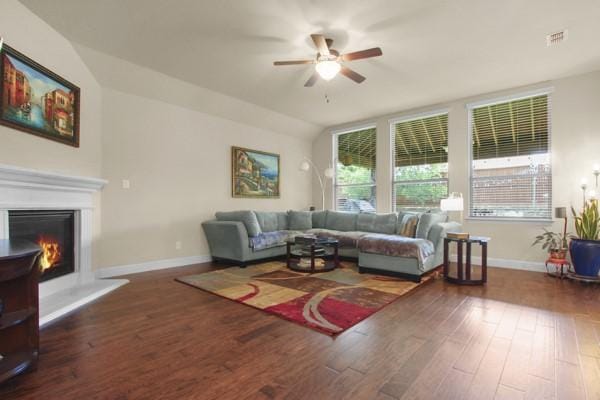 1165 Breakwater Dr, Frisco, TX 75036 - living area featuring ceiling fan, wood finished floors, and a glass covered fireplace