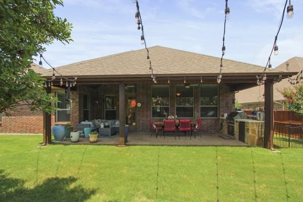 1165 Breakwater Dr, Frisco, TX 75036 - back of house featuring a patio area, brick siding, and roof with shingles
