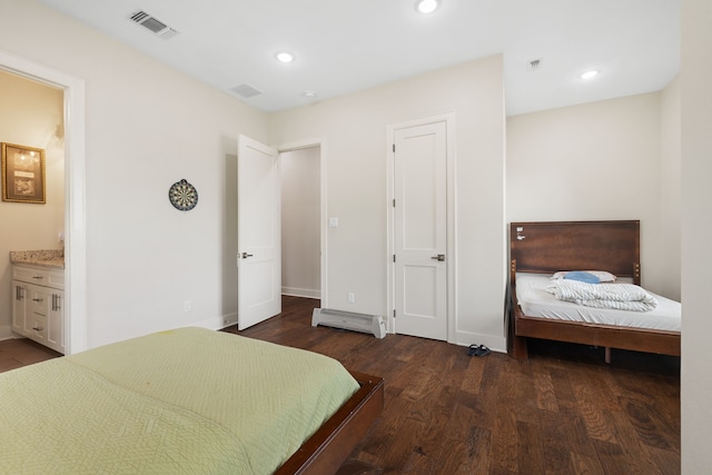 580 Vz County Road 3422, Wills Point, TX 75169 - bedroom featuring dark wood-style flooring, ensuite bath, recessed lighting, and a baseboard radiator