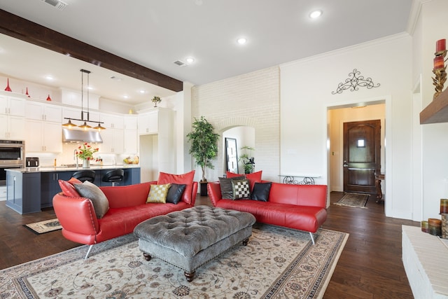 580 Vz County Road 3422, Wills Point, TX 75169 - living area featuring arched walkways, dark wood-type flooring, beamed ceiling, recessed lighting, and crown molding