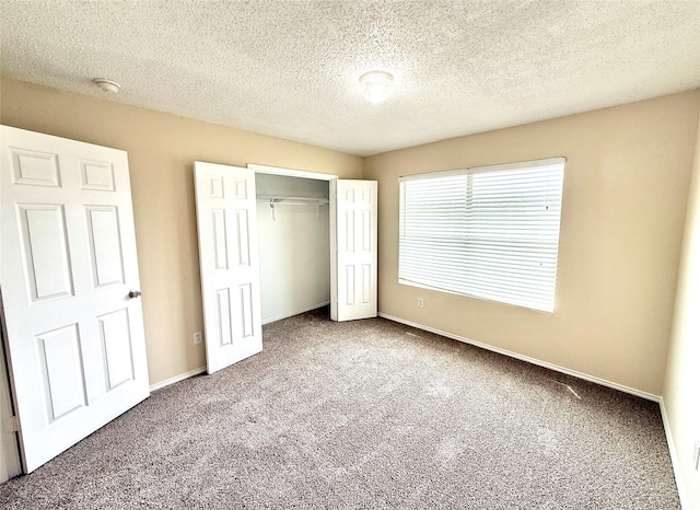 2024 Kings Forest Dr, Heartland, TX 75126 - unfurnished bedroom featuring carpet flooring, a closet, and a textured ceiling