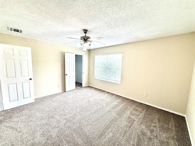 2024 Kings Forest Dr, Heartland, TX 75126 - unfurnished bedroom with carpet, a closet, ceiling fan, and a textured ceiling