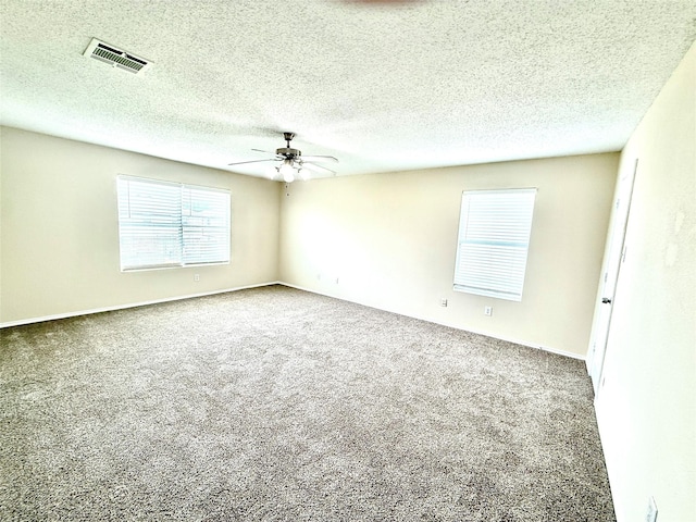 2024 Kings Forest Dr, Heartland, TX 75126 - empty room with a ceiling fan, carpet, and a textured ceiling