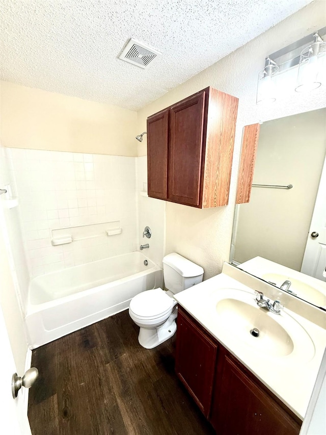 2024 Kings Forest Dr, Heartland, TX 75126 - bathroom featuring wood finished floors, a textured ceiling, shower / bath combination, and vanity