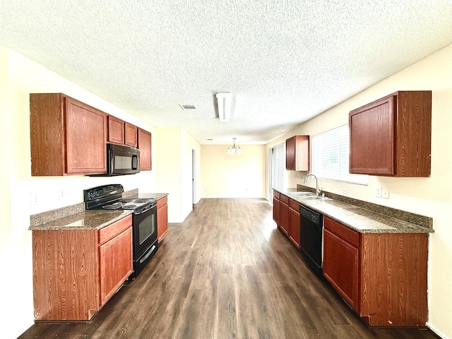 2024 Kings Forest Dr, Heartland, TX 75126 - kitchen with black appliances, dark wood-type flooring, a textured ceiling, and a chandelier