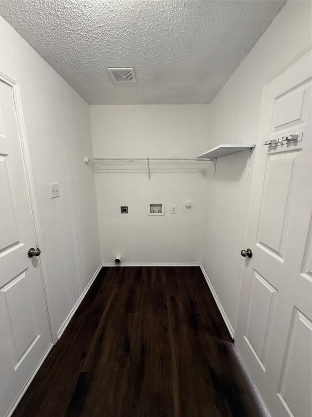 2024 Kings Forest Dr, Heartland, TX 75126 - laundry area with electric dryer hookup, washer hookup, a textured ceiling, and dark wood-style flooring