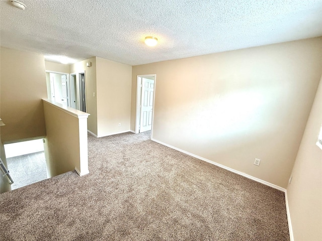 2024 Kings Forest Dr, Heartland, TX 75126 - spare room with carpet flooring and a textured ceiling
