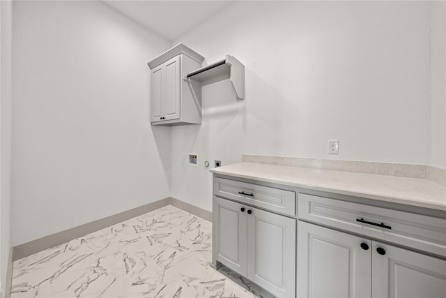 716 Burr Oak Ln, Weatherford, TX 76085 - washroom with electric dryer hookup, cabinet space, light marble finish floors, and hookup for a washing machine