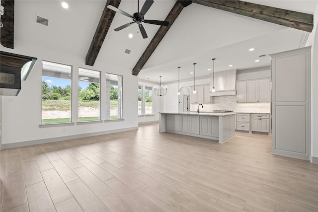 716 Burr Oak Ln, Weatherford, TX 76085 - unfurnished living room featuring a ceiling fan, recessed lighting, beam ceiling, high vaulted ceiling, and light wood-type flooring