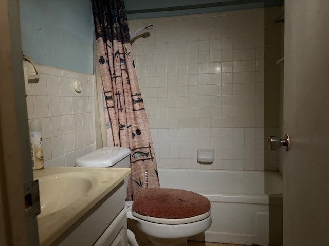 4317 Gram Ln, Waco, TX 76705 - bathroom featuring tile walls, shower / bathtub combination with curtain, and vanity