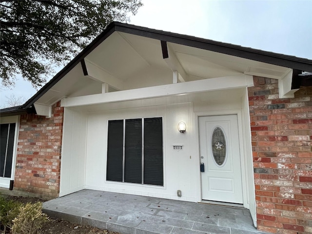 2113 Glencrest Ln, Garland, TX 75040 - property entrance featuring brick siding
