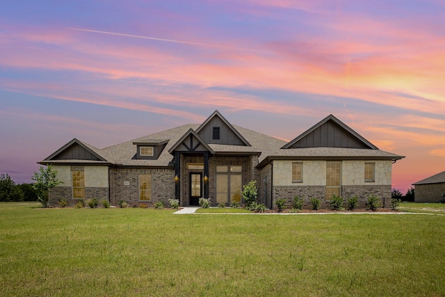 6821 Hayes Rd, Midlothian, TX 76065 - view of front of home featuring brick siding, a yard, board and batten siding, and a shingled roof