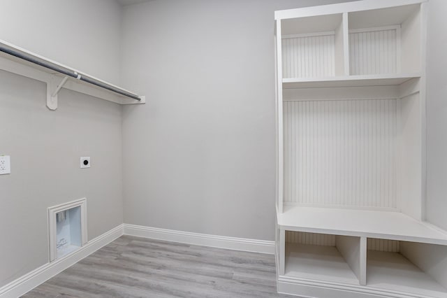 6821 Hayes Rd, Midlothian, TX 76065 - laundry area featuring electric dryer hookup and wood finished floors