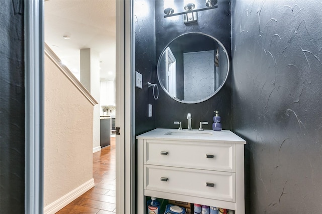 1504 Vista Bend Dr, Allen, TX 75002 - bathroom featuring wood finished floors and vanity