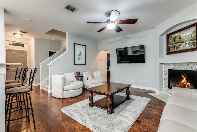 1504 Vista Bend Dr, Allen, TX 75002 - living area featuring ceiling fan, dark wood-style flooring, a fireplace, and stairway
