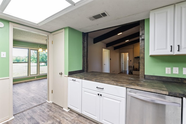 10202 Fm 1895, Kaufman, TX 75142 - kitchen featuring stainless steel dishwasher, white cabinets, light wood-style flooring, and beam ceiling