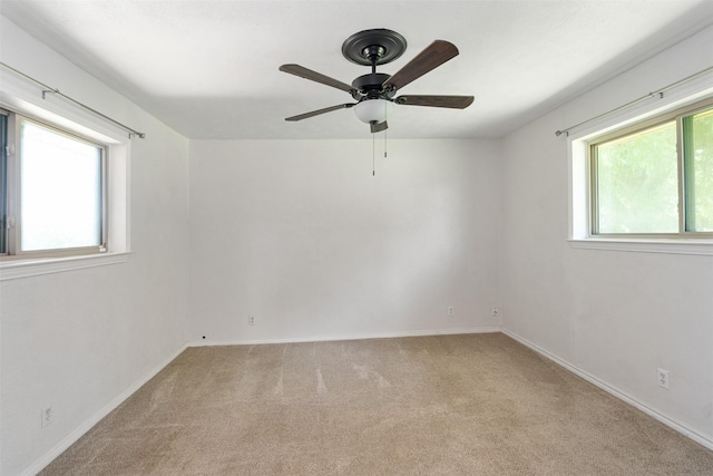 10202 Fm 1895, Kaufman, TX 75142 - carpeted empty room featuring plenty of natural light and a ceiling fan