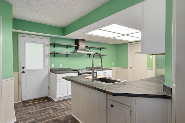 10202 Fm 1895, Kaufman, TX 75142 - kitchen with wall chimney exhaust hood, dark wood-style flooring, white cabinets, open shelves, and a textured ceiling