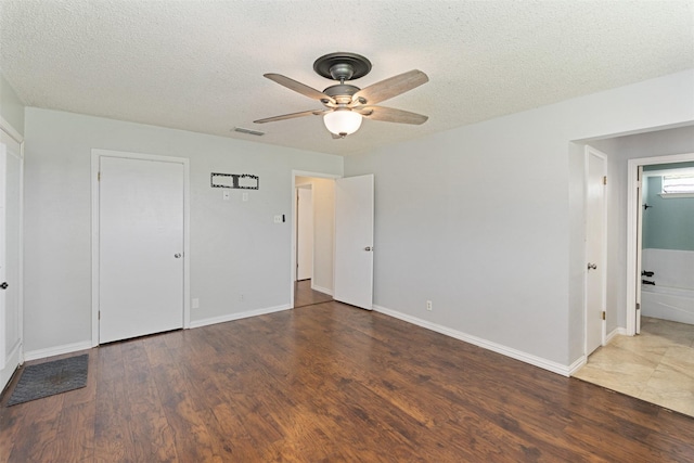 10202 Fm 1895, Kaufman, TX 75142 - unfurnished bedroom featuring wood finished floors, a textured ceiling, and a ceiling fan