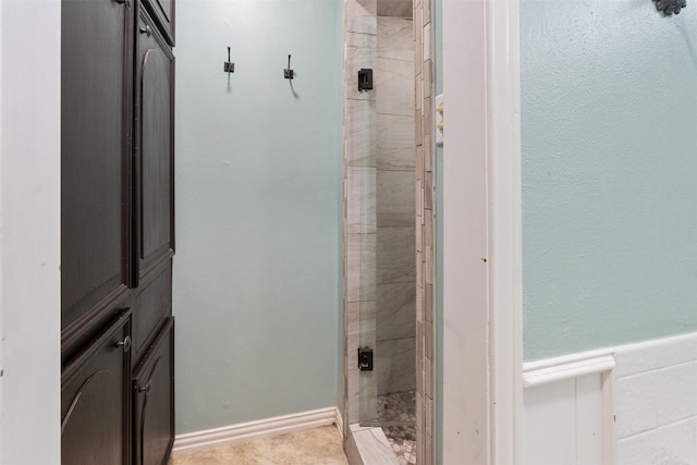 10202 Fm 1895, Kaufman, TX 75142 - bathroom featuring a shower stall and a wainscoted wall