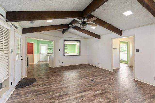 10202 Fm 1895, Kaufman, TX 75142 - unfurnished living room featuring dark wood-style floors, ceiling fan, and a textured ceiling