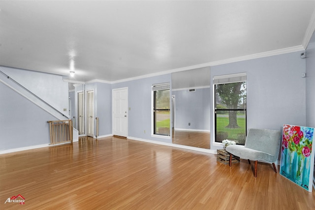 10030 Alondra St, Shreveport, LA 71115 - living room with wood finished floors, stairs, and ornamental molding