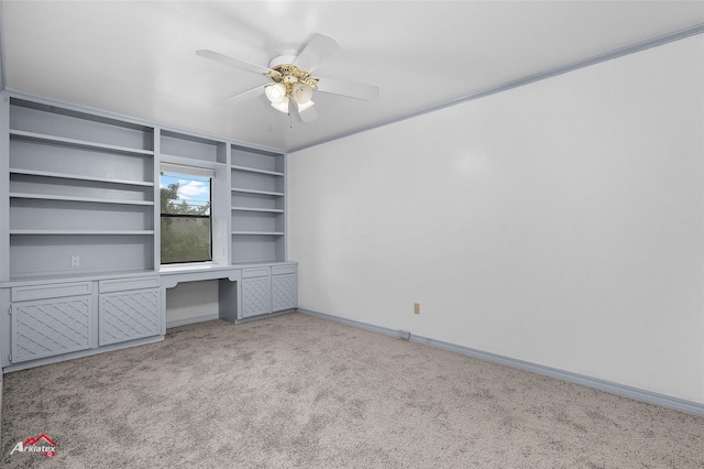 10030 Alondra St, Shreveport, LA 71115 - unfurnished bedroom with light colored carpet, built in study area, and a ceiling fan
