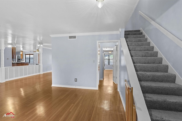 10030 Alondra St, Shreveport, LA 71115 - stairs featuring wood finished floors and ornamental molding