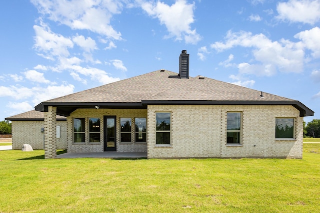 7050 Champion Rd, Midlothian, TX 76065 - rear view of property with a yard, roof with shingles, a chimney, a patio, and brick siding