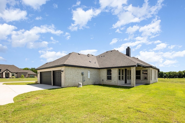 7050 Champion Rd, Midlothian, TX 76065 - rear view of property featuring concrete driveway, a garage, a lawn, a chimney, and brick siding