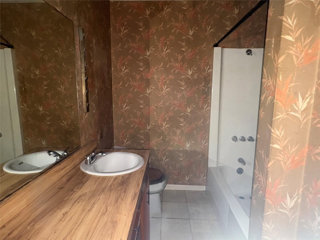 607 Baylor St, Nocona, TX 76255 - bathroom with vanity, wallpapered walls, bathtub / shower combination, and tile patterned flooring